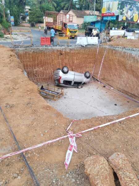 ಮೇಲ್ಸೇತುವೆ ಕಾಮಗಾರಿ ವೇಳೆ ಅಗೆದಿದ್ದ ಗುಂಡಿಗೆ ಮಗುಚಿಬಿದ್ದ ಕಾರು