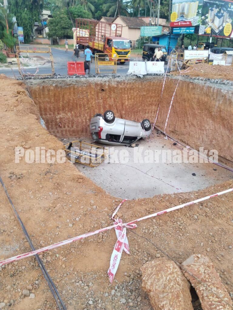 ಮೇಲ್ಸೇತುವೆ ಕಾಮಗಾರಿ ವೇಳೆ ಅಗೆದಿದ್ದ ಗುಂಡಿಗೆ ಮಗುಚಿಬಿದ್ದ ಕಾರು
